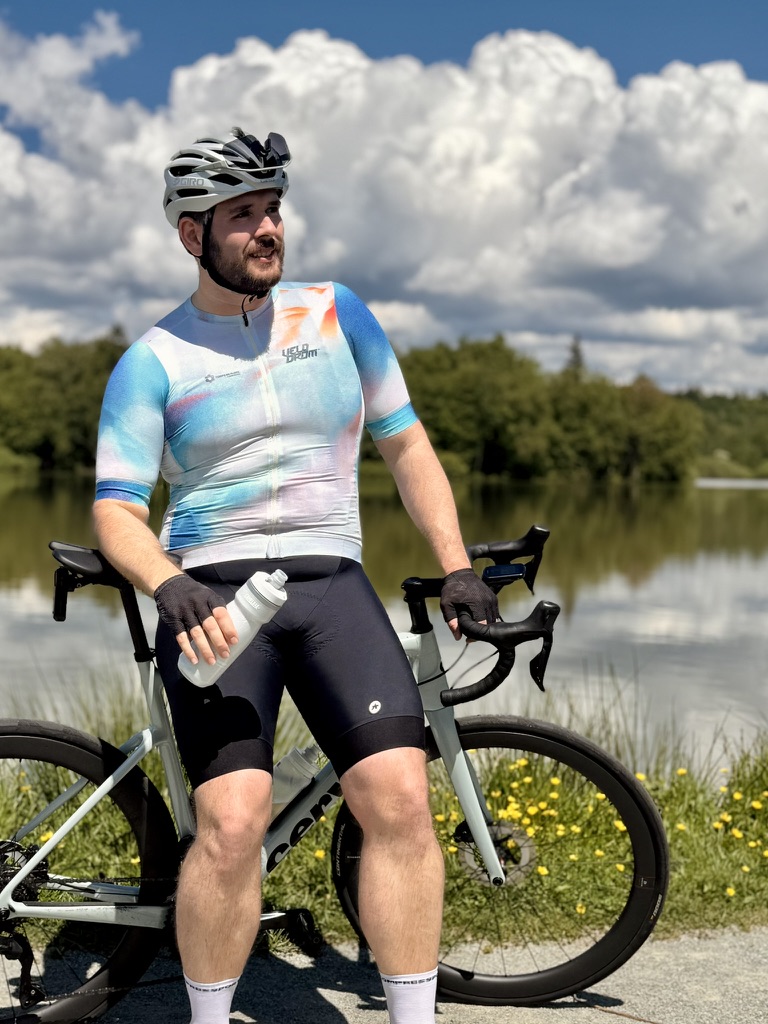 Adrien on a road bike by a lake